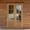 Double Glazed Timber Doors on a log cabin