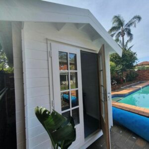A pool cabana for storage beside a swimming pool in Gold Coast QLD